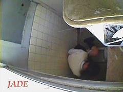A horny Asian chick masturbating in the college toilet
