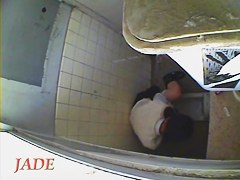 A horny Asian chick masturbating in the college toilet
