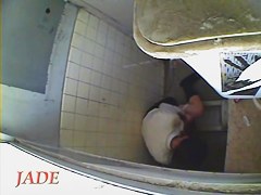 A horny Asian chick masturbating in the college toilet