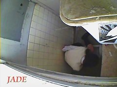 A horny Asian chick masturbating in the college toilet