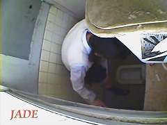 A horny Asian chick masturbating in the college toilet