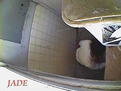 A horny Asian chick masturbating in the college toilet