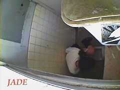 A horny Asian chick masturbating in the college toilet