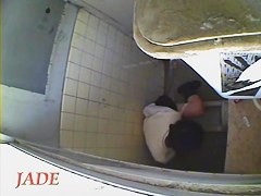 A horny Asian chick masturbating in the college toilet