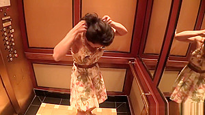Big tit Asian MILF fucks behind the scenes