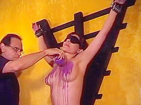 Big tits hottie Audrey ends up with hot wax over her tits in a BDSM session