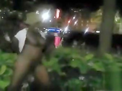 Black mama exposes her big tits on the street