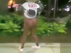 Black mama exposes her big tits on the street