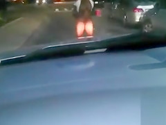 Black mama exposes her big tits on the street