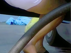 Blonde MILF shows cleavage and ass at the carwash