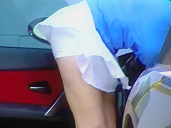 Blonde MILF shows cleavage and ass at the carwash