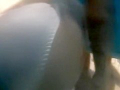 Bronze girl with small tan lined boobs in beach cabin