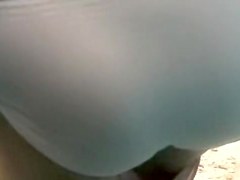 Bronze girl with small tan lined boobs in beach cabin