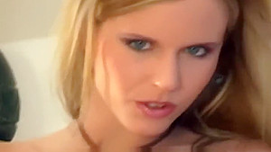 Busty babe stripping and teasing in stockings