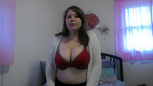 Busty girl smokes and gives a peak
