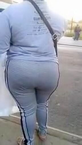Candid booty milf waiting at bus stop