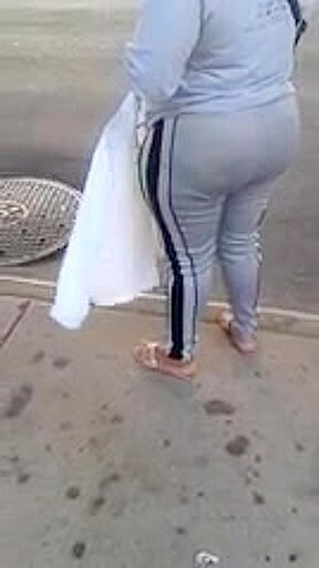 Candid booty milf waiting at bus stop