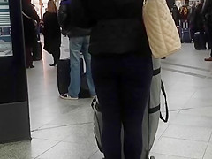 Candid street, shiny jacket and blue leggings