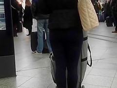 Candid street, shiny jacket and blue leggings