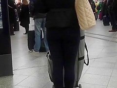 Candid street, shiny jacket and blue leggings