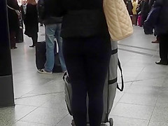 Candid street, shiny jacket and blue leggings