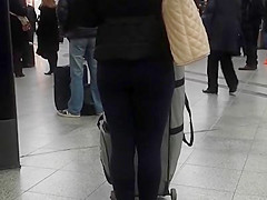 Candid street, shiny jacket and blue leggings