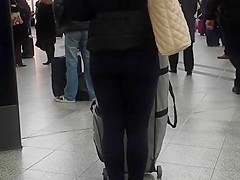 Candid street, shiny jacket and blue leggings