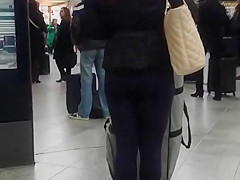 Candid street, shiny jacket and blue leggings