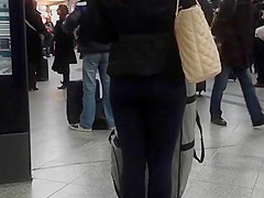 Candid street, shiny jacket and blue leggings