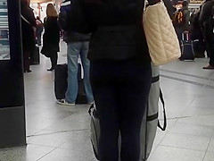 Candid street, shiny jacket and blue leggings