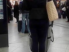 Candid street, shiny jacket and blue leggings