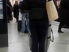 Candid street, shiny jacket and blue leggings
