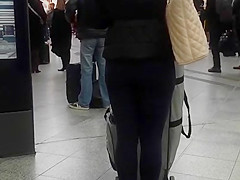 Candid street, shiny jacket and blue leggings