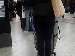 Candid street, shiny jacket and blue leggings