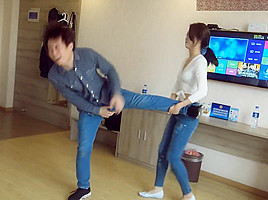 Chinese ballbust in tight jeans