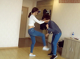 Chinese ballbust in tight jeans