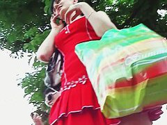 Cute brunette in red dress upskirt