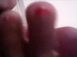 Ebony footjob: big toes jerking cock