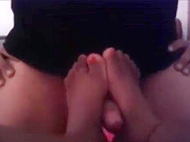 Ebony footjob: big toes jerking cock