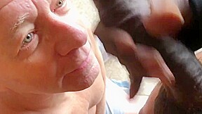 Fag sucks off a big black cock gets huge cum facial