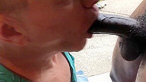 Fag sucks off a big black cock gets huge cum facial