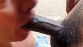 Fag sucks off a big black cock gets huge cum facial