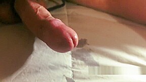 Fast slapping a tied cock