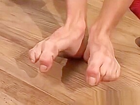 Feet loving twink working on his huge hard dick solo