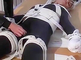 Girl In Bondage Bed, Cuffs And Shackles