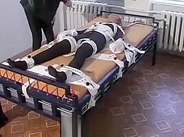 Girl In Bondage Bed, Cuffs And Shackles