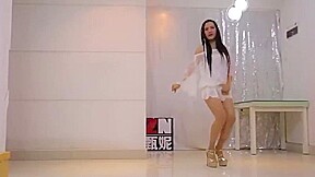 Girl in extremly short and transparent dress and high heels