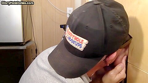 Gray DILF sucks and tugs gloryhole dick until spermed