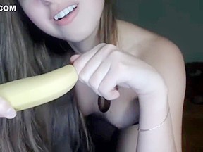 Horny young girl sucks banana