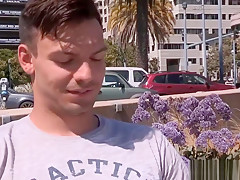 Hot guy picking up and blowing off a muscular man on the bea